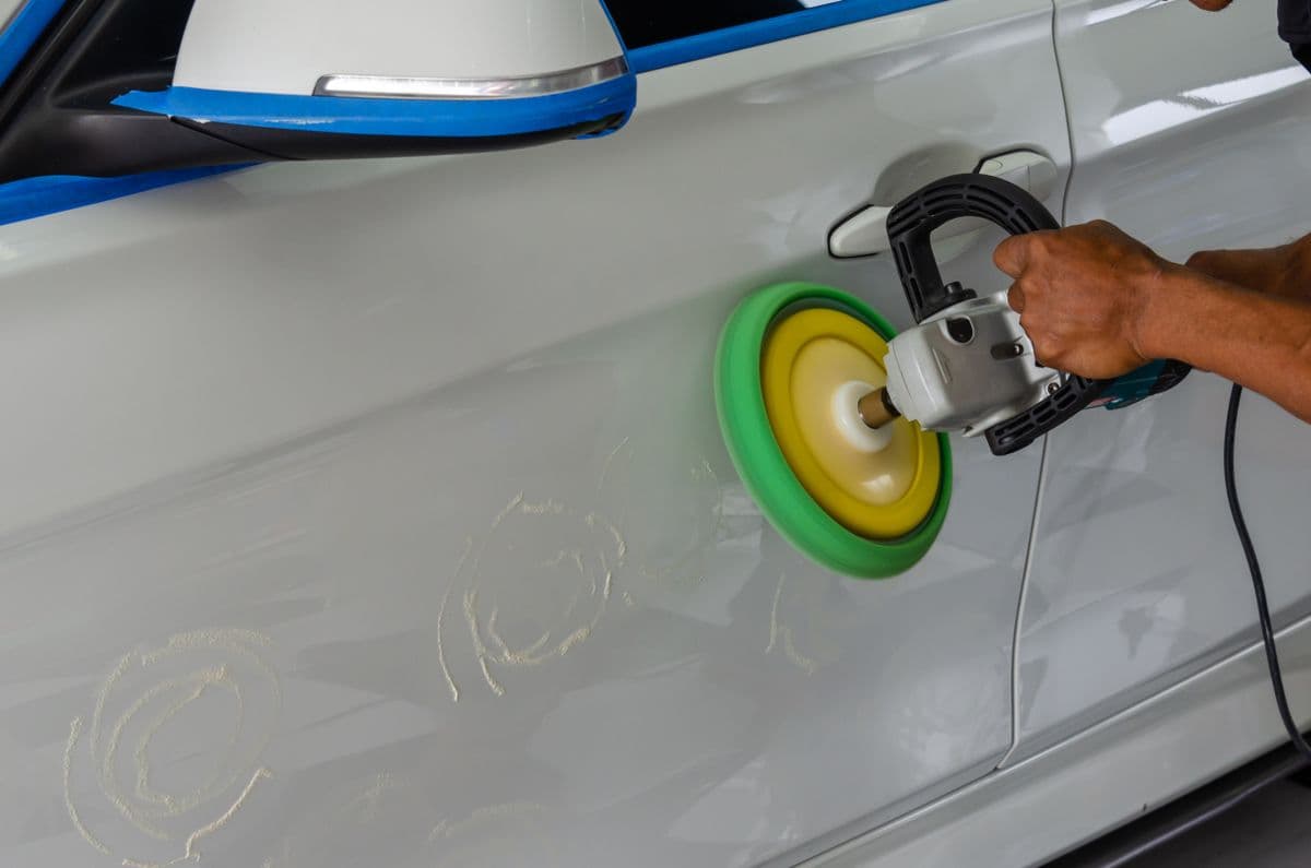 Close-up of glossy black paint reflecting light after decontamination and sealant